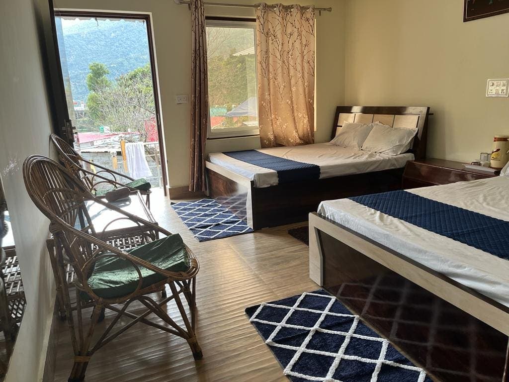 Family Room at Manodaya Homes homestay in Uttarakhand - Spacious family room perfect for groups with family friendly, two beds, extra space